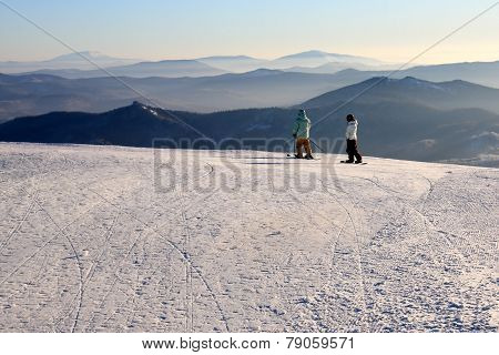 Mountain-skiers on the top of mountain.