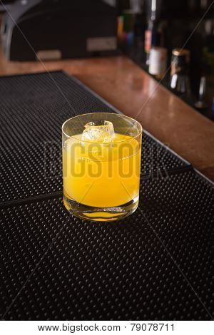 Screw Driver Cocktail On A Bar Ribber Mat