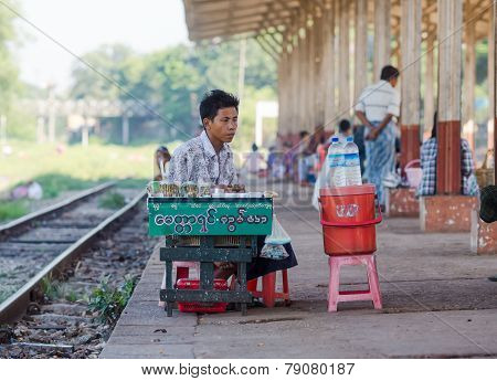 Vendor At A Railway Station In Yangon, Myanmar.