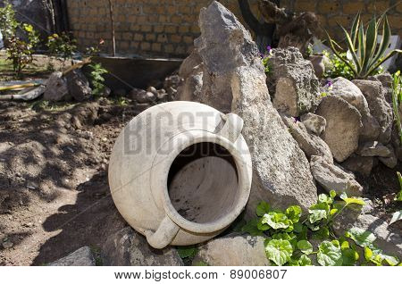Old the clay pitcher in garden