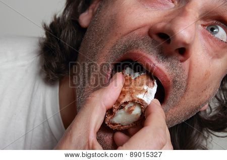 Hungry Man Eating Pastry