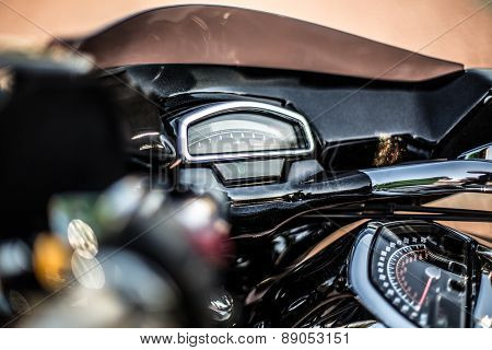 Black trike standing on the light street
