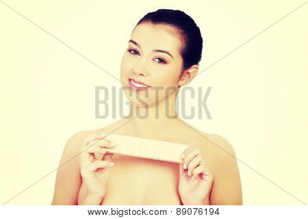 Beautiful woman holding a waffer