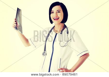 Young doctor anylising rentgen photo