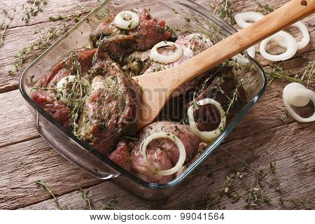 Raw Meat In A Green Marinade With Onions In A Bowl Closeup. Horizontal