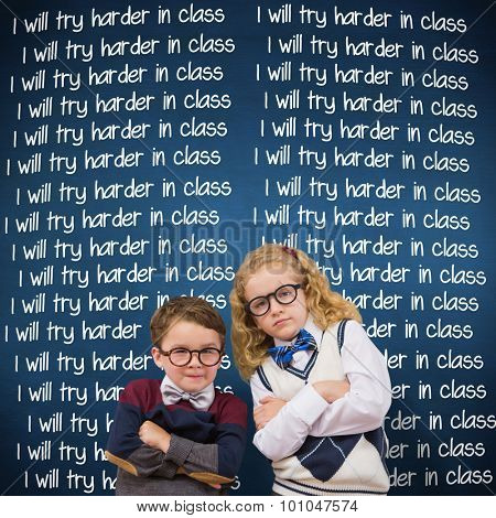 Cute pupils looking at camera against blue chalkboard