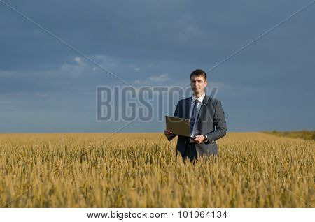 Happy Farmer. Buisnessmen In A Wheat Field