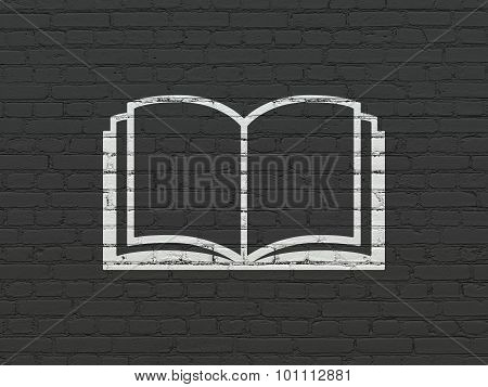 Studying concept: Book on wall background