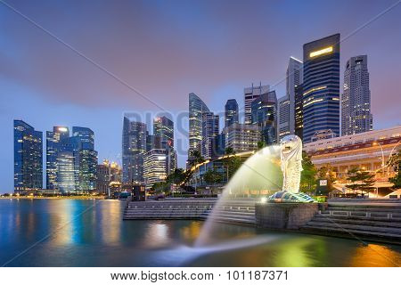 SINGAPORE - SEPTEMBER 3, 2015: The Merlion statue fountain and the Singapore skyline. The landmark statue is considered the personification of Singapore.