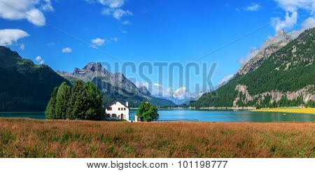 Amazing sunny day at Champferersee lake in the Swiss Alps. Silvaplana village, Switzerland, Europe.