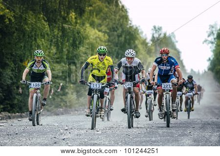 group of cyclists long downhill