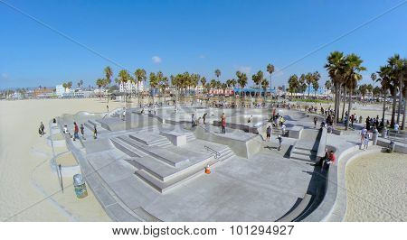 LOS ANGELES - OCT 19, 2014: Many young people get fun on Venice Beach Skate Park at sunny day. Aerial view. Skatepark total area is 16000 sq.ft.