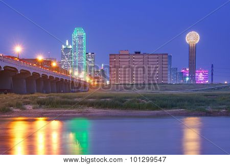 Downtown Dallas, Texas Skyline At Night Reflecting In Trinity River