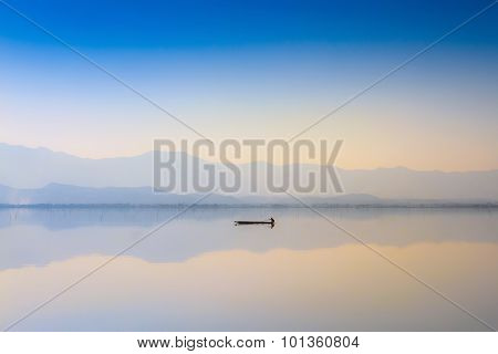 Calmness Lake In Sunset