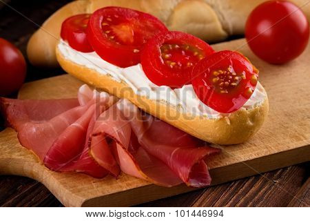 Four Tomato Slices On Fresh Baguette
