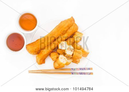 Fried Bread Stick Or You Tiao Served With Chinese Tea.