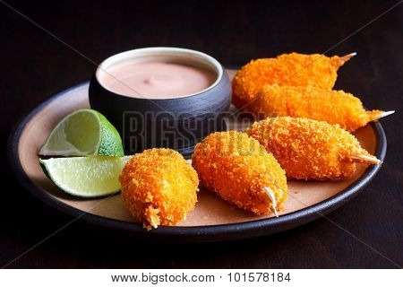 Fried breaded surimi crab claw.