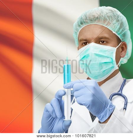 Doctor With Syringe In Hands And Flag On Background Series - Ivory Coast