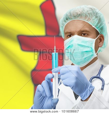 Doctor With Syringe In Hands And Canadian Province Flag On Background Series - Nunavut