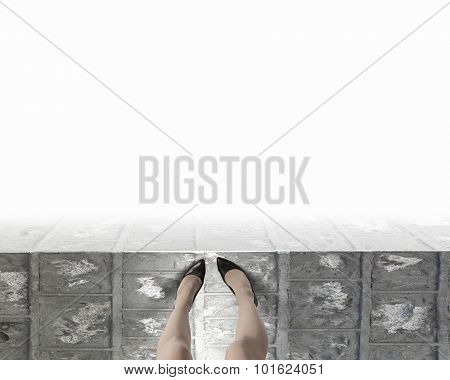 Woman standing on the edge of the roof