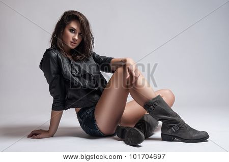 Fashion Rocker Style Model Girl Portrait. Hairstyle. Rocker or Punk Woman Makeup Hairdo and Accessories
