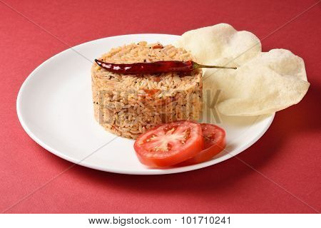 Spicy tomato rice with Poppadom
