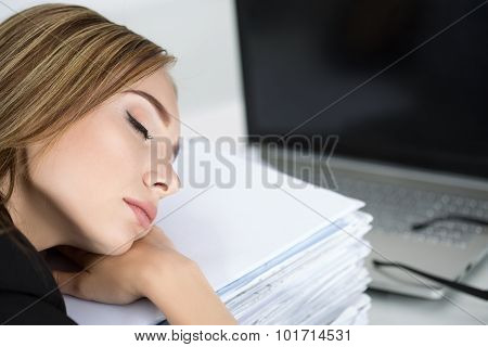 Tired Business Woman Slleeping On Heap Of Papers