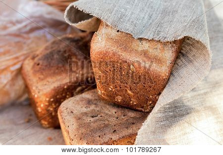 Loaf Of Rye Bread Covered With Coarse Linen Cloth