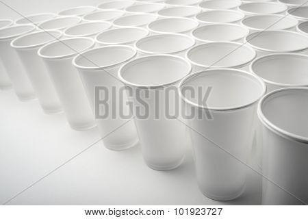 Large group of disposable plastic cups.