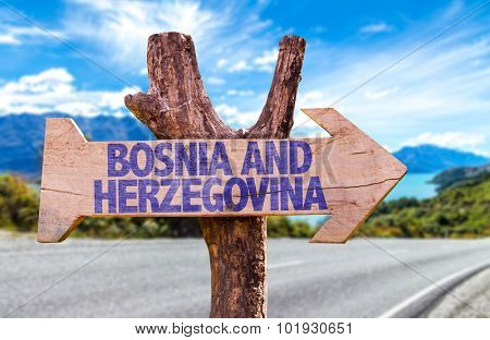 Bosnia and Herzegovina wooden sign with road background