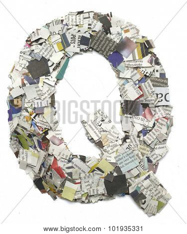 The letter  JQ   made from newspaper confetti