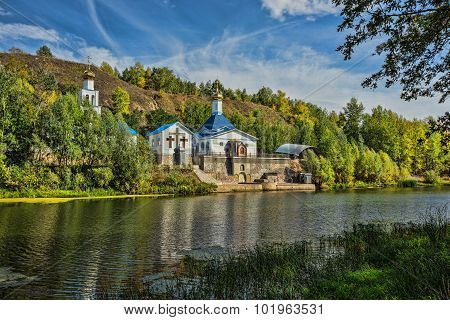 Russian Orthodox Church On The Shore Of A Pond