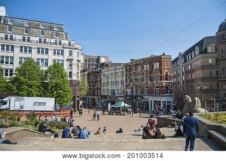 Birmingham, United Kingdom - May 12, 2016: A view to City Council House from Victoria Square in Birmingham, United Kingdom. Locals and tourists. Popular place where locals hang out and chill.