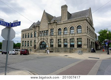 CADILLAC, MICHIGAN / UNITED STATES - MAY 31, 2017: 
The old Cadillac City Hall building now houses the Cadillac Area Visitors Bureau in downtown Cadillac.