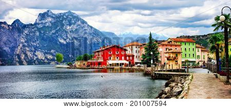 Alpine scenery - beautiful lake Lago di Garda and village Torbole. italy