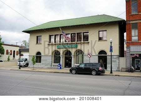CADILLAC, MICHIGAN / UNITED STATES - MAY 31, 2017: 
The Cadillac Evening News is published daily from the Cadillac News building in downtown Cadillac.