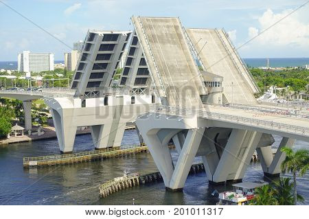 FORT LAUDERDALE, USA - JULY 11, 2017: Aerial view of an opened draw bridge raised to let ship pass through at harbor in Fort Lauderdale, Florida.