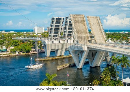 FORT LAUDERDALE, USA - JULY 11, 2017: Aerial view of an opened draw bridge raised to let ship pass through at harbor in Fort Lauderdale, Florida.