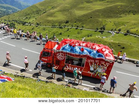 Col de PeyresourdeFrance- July 23 2014: Vittel vehicle during the passing of the Publicity Caravan on the road to Col de Peyresourde in Pyrenees Mountains in the stage 17 of Le Tour de France on 23 July 2014.Vittel is a French bottled water brand.
