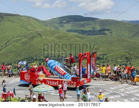 Col de PeyresourdeFrance- July 23 2014: Vittel vehicle during the passing of the Publicity Caravan on the road to Col de Peyresourde in Pyrenees Mountains in the stage 17 of Le Tour de France on 23 July 2014.Vittel is a French bottled water brand.