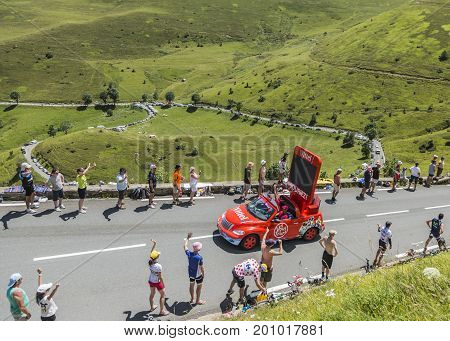 Col de PeyresourdeFrance- July 23 2014: Vittel vehicle during the passing of the Publicity Caravan on the road to Col de Peyresourde in Pyrenees Mountains in the stage 17 of Le Tour de France on 23 July 2014.Vittel is a French bottled water brand.