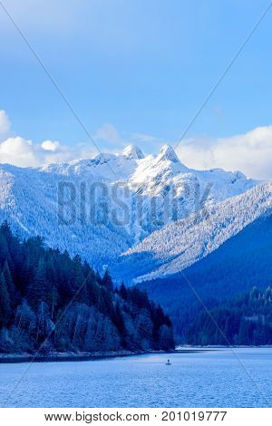 Snow Mountains and Capilano Lake in Vancouver British Columbia Pacific Northwest.