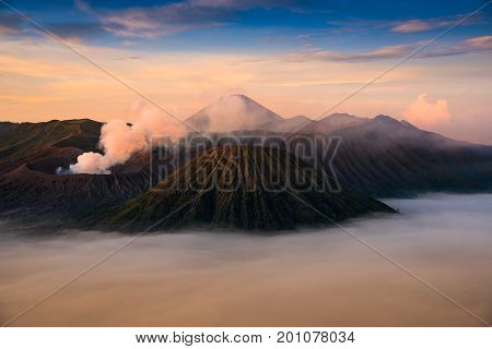 Mount Bromo volcano (Gunung Bromo) during sunrise from viewpoint on Mount Penanjakan. Mount Bromo located in Bromo Tengger Semeru National Park East Java Indonesia.