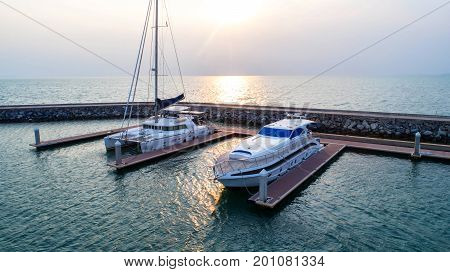 Pier speedboat. A marina lot. This is usually the most popular tourist attractions on the beach.Yacht and sailboat is moored at the quay.Aerial view by drone.Top view.