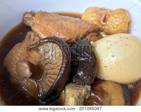 Stewed Pork With Herb, Egg And Wing Chicken  In Soy Sauce Or Sweet Brown Gravy (moo Pa-lo) In White