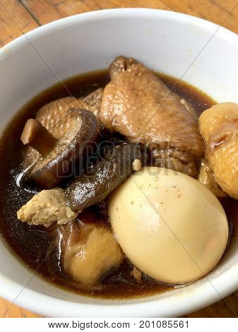 Stewed Pork With Herb, Egg And Wing Chicken  In Soy Sauce Or Sweet Brown Gravy (moo Pa-lo) In White