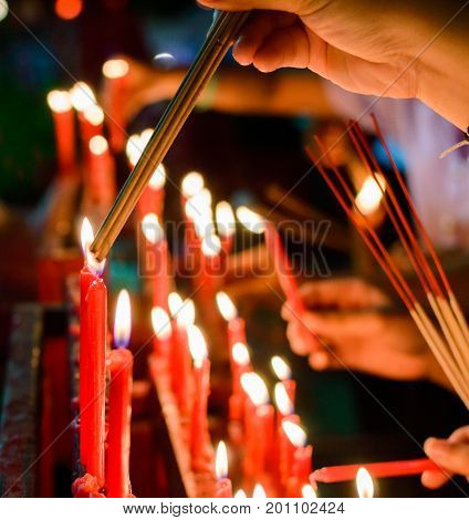 Burning red chinese candle in temple. New year ritual