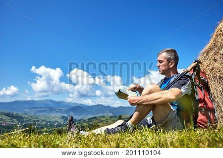 Hiking in the mountains with a backpack in the summer.