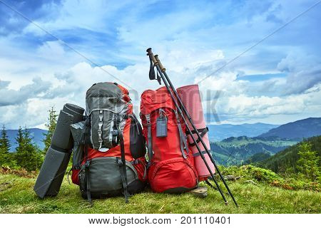 Backpacks in the mountains with views of the mountains.