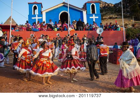 PUNO, PERU - AUGUST 07: Authentic Colorful Carnival on the streets of Puno, Peru near the high altutude Titicaca lake on August 7th, 2017